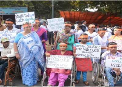participants with disabilities holding placard