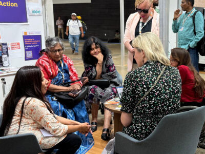 Prof Asha Hans with others in a group discussion at COP 30