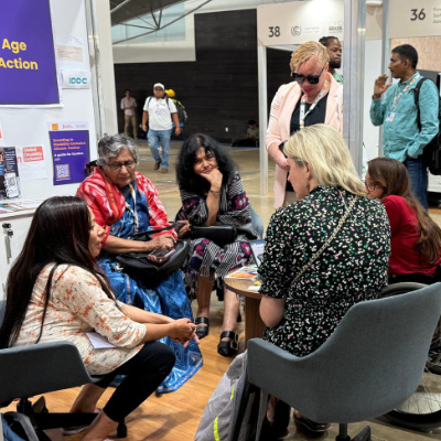 Prof Asha Hans with others in a group discussion at COP 30